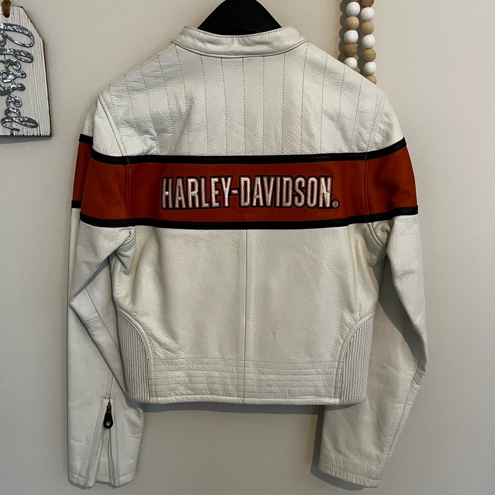 Brand new. Only worn once. Genuine leather with heavy duty embroidery.
